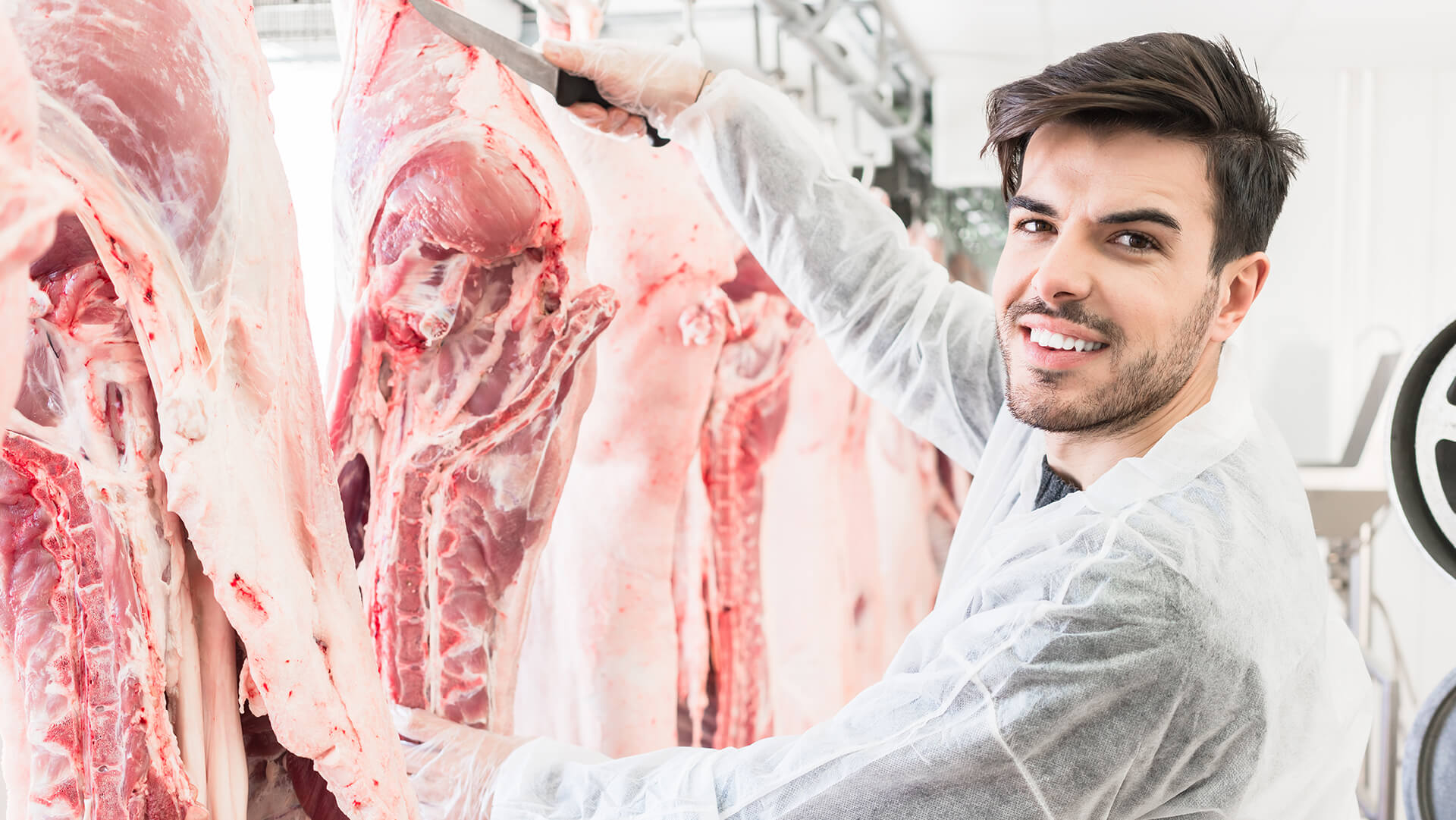 Butcher cutting meat